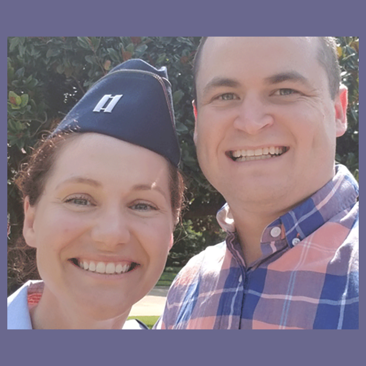 Photo of a man and a woman, both veterans with one in uniform, smiling for a selfie together